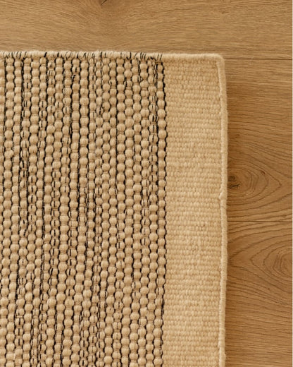 Alfombra de lana beige y negro